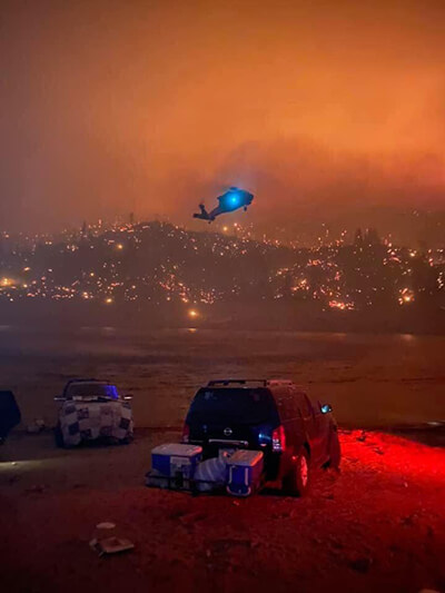 A California Army National Guard UH-60 Black Hawk makes its way around treacherous conditions to rescue trapped campers inside the Sierra National Forest, California, Sept. 5.